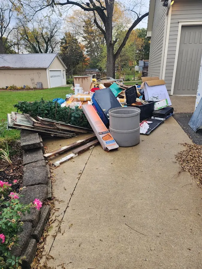 Dumpster being loaded with debris for 10 Yard Dumpster Rental in Rayville